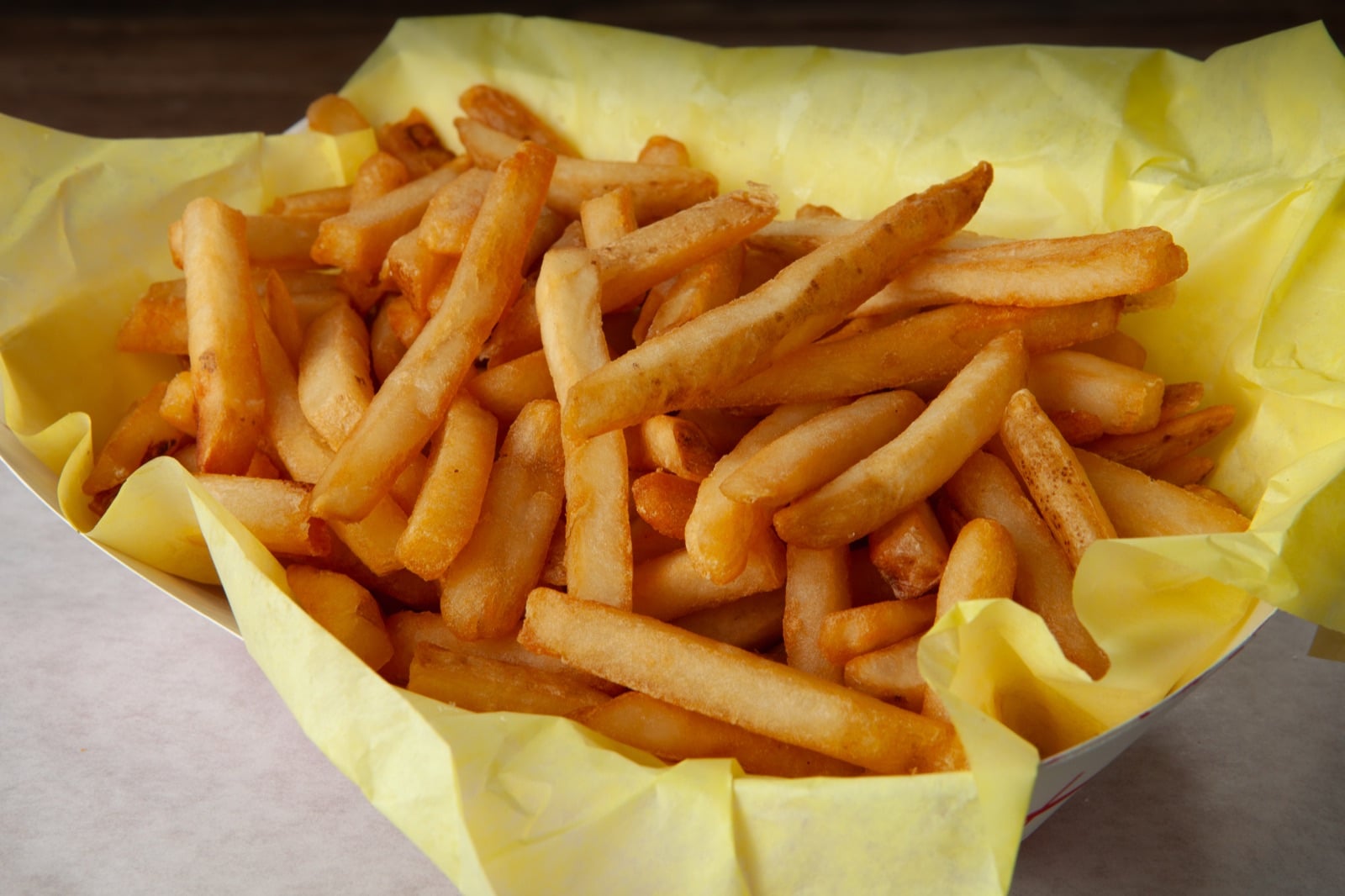 Golden hand-cut fries in a basket