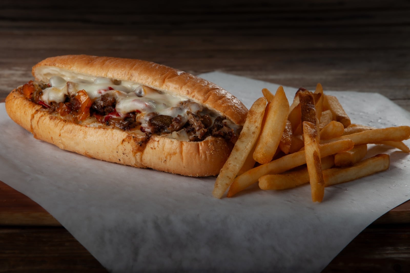 Philly cheesesteak with melted provolone and griddled vegetables